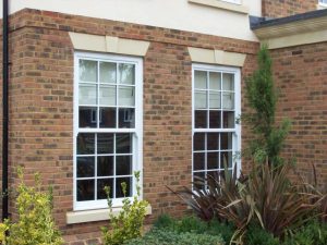 Dual white vertical sliding windows