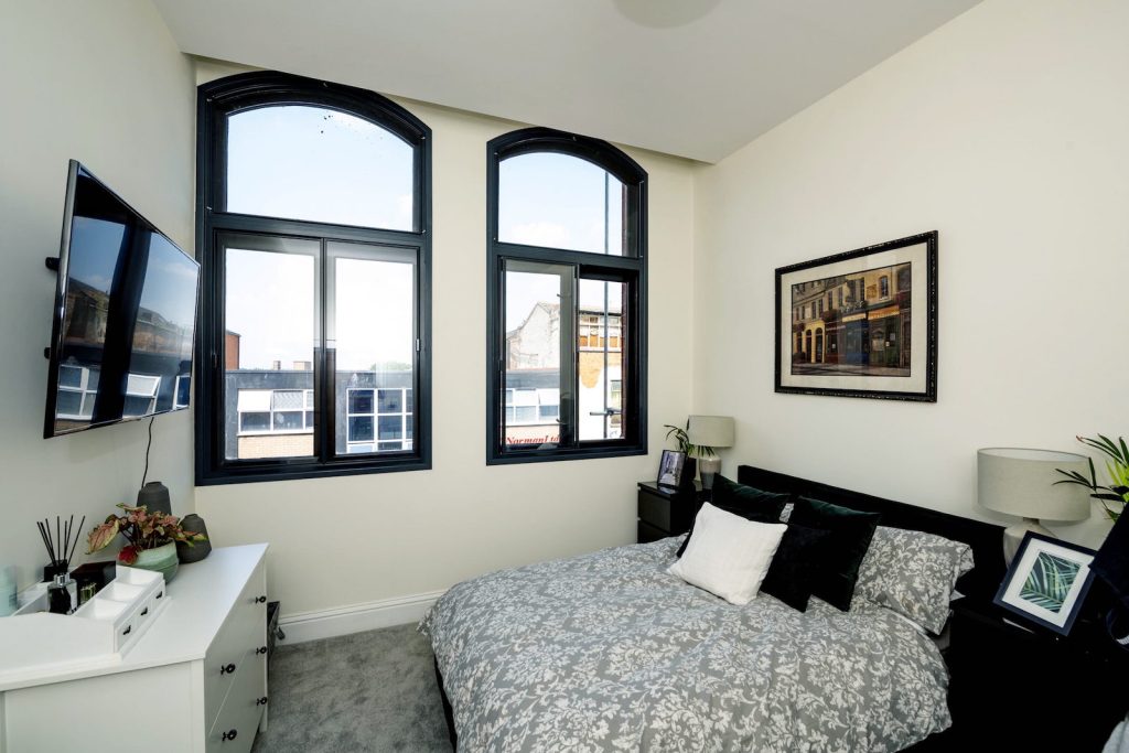 Granada secondary glazing fitted to arched bedroom windows, offering enhanced thermal insulation and maintaining the original window design.